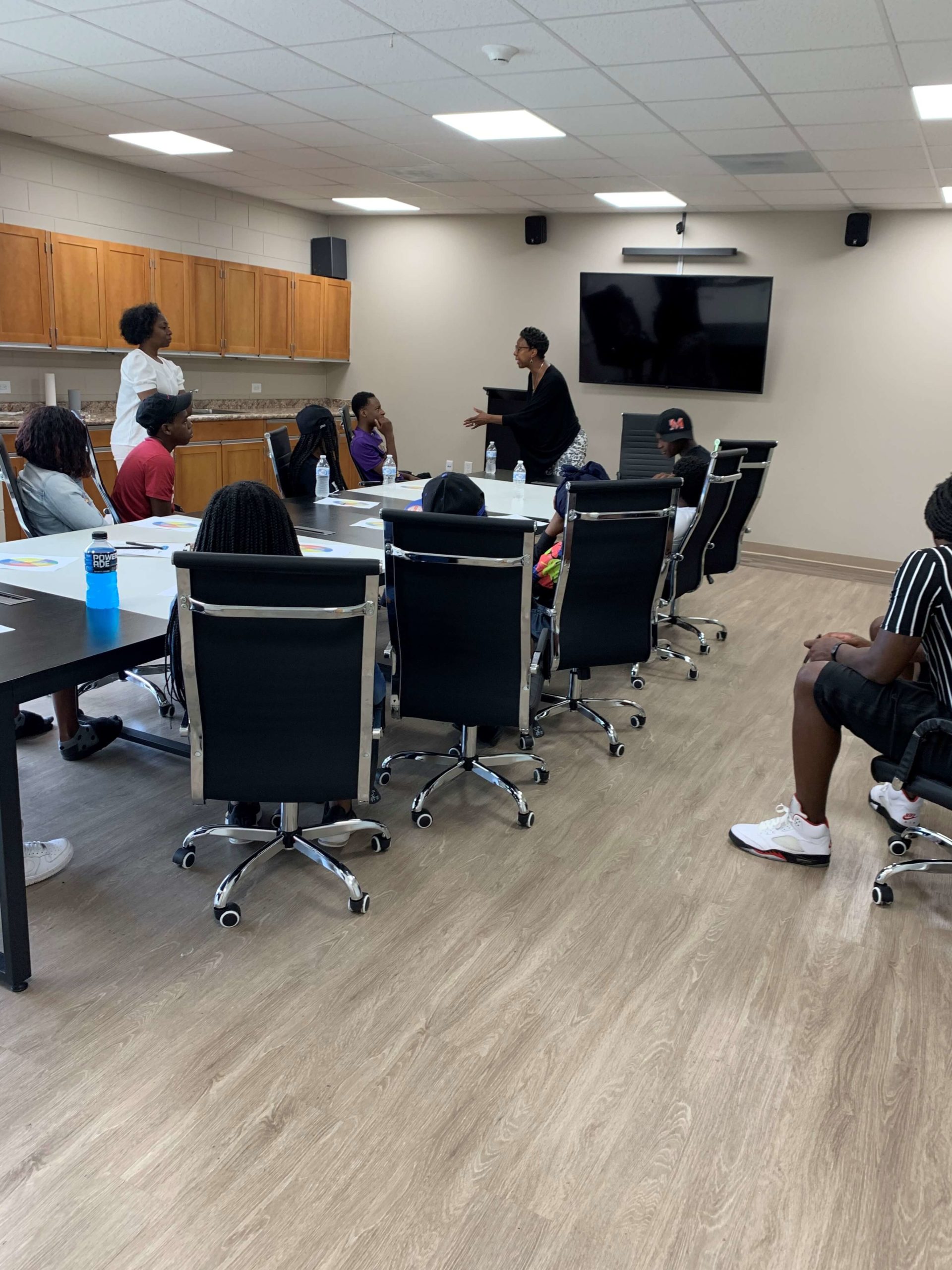 Judge Colvin offers insight and encouragement to children attending the AfterZone Camp at Booker T. Washington Center in the Pleasant Hill neighborhood.